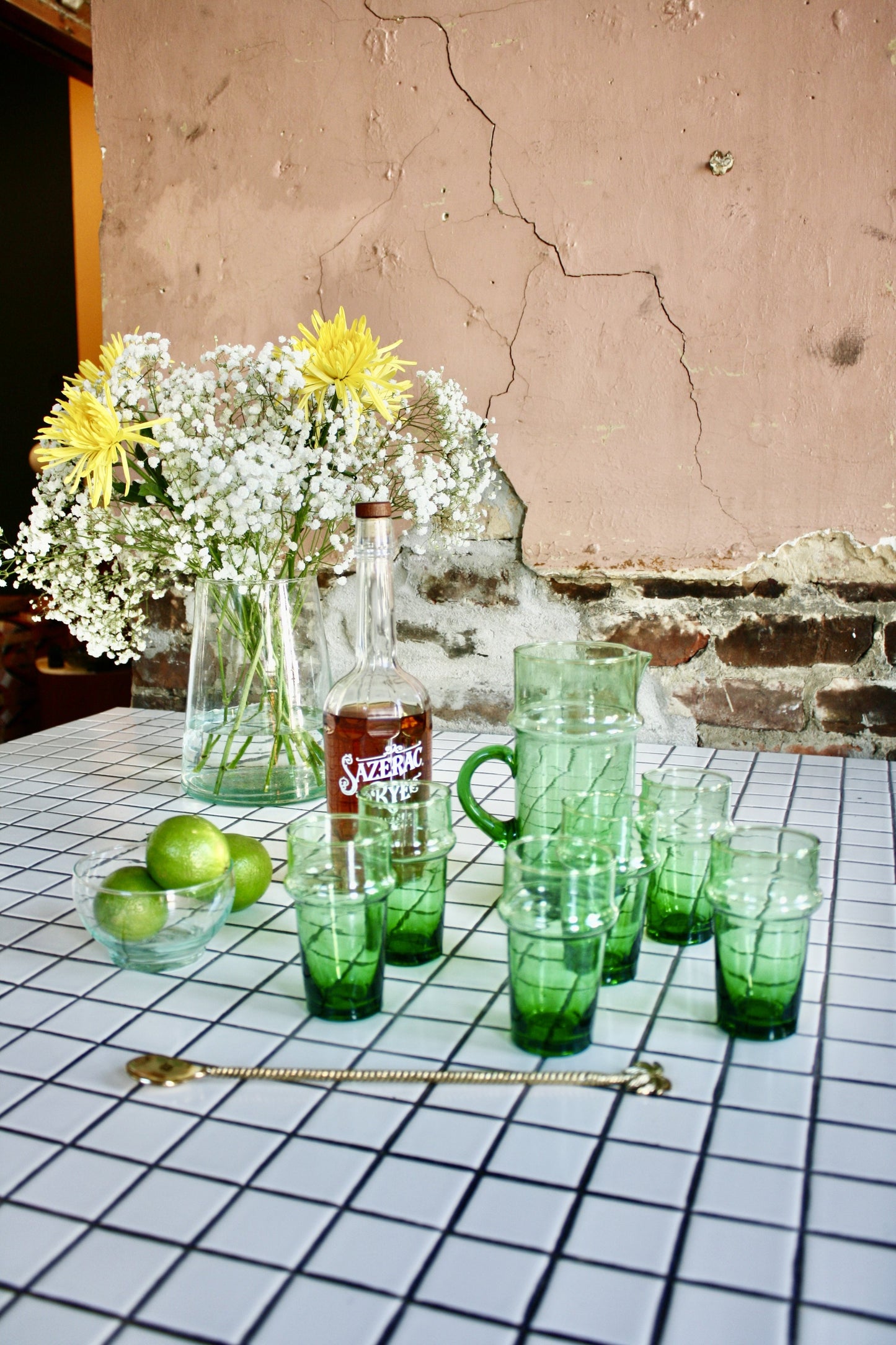 Set of 12 green handblown glasses handmade in Morocco from recycled glass by artisans using traditional techniques since 1946.